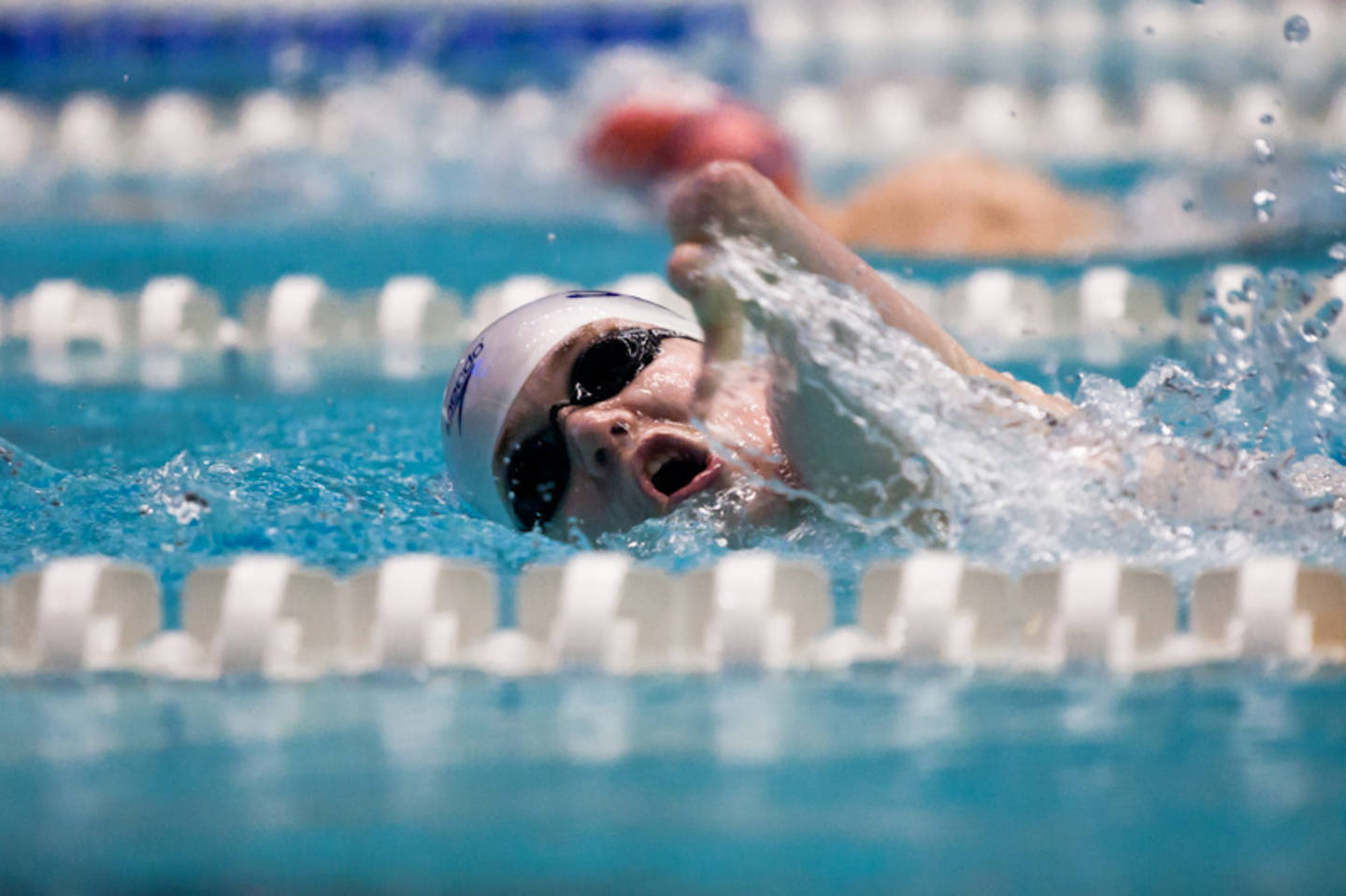 A man swimming in the pool