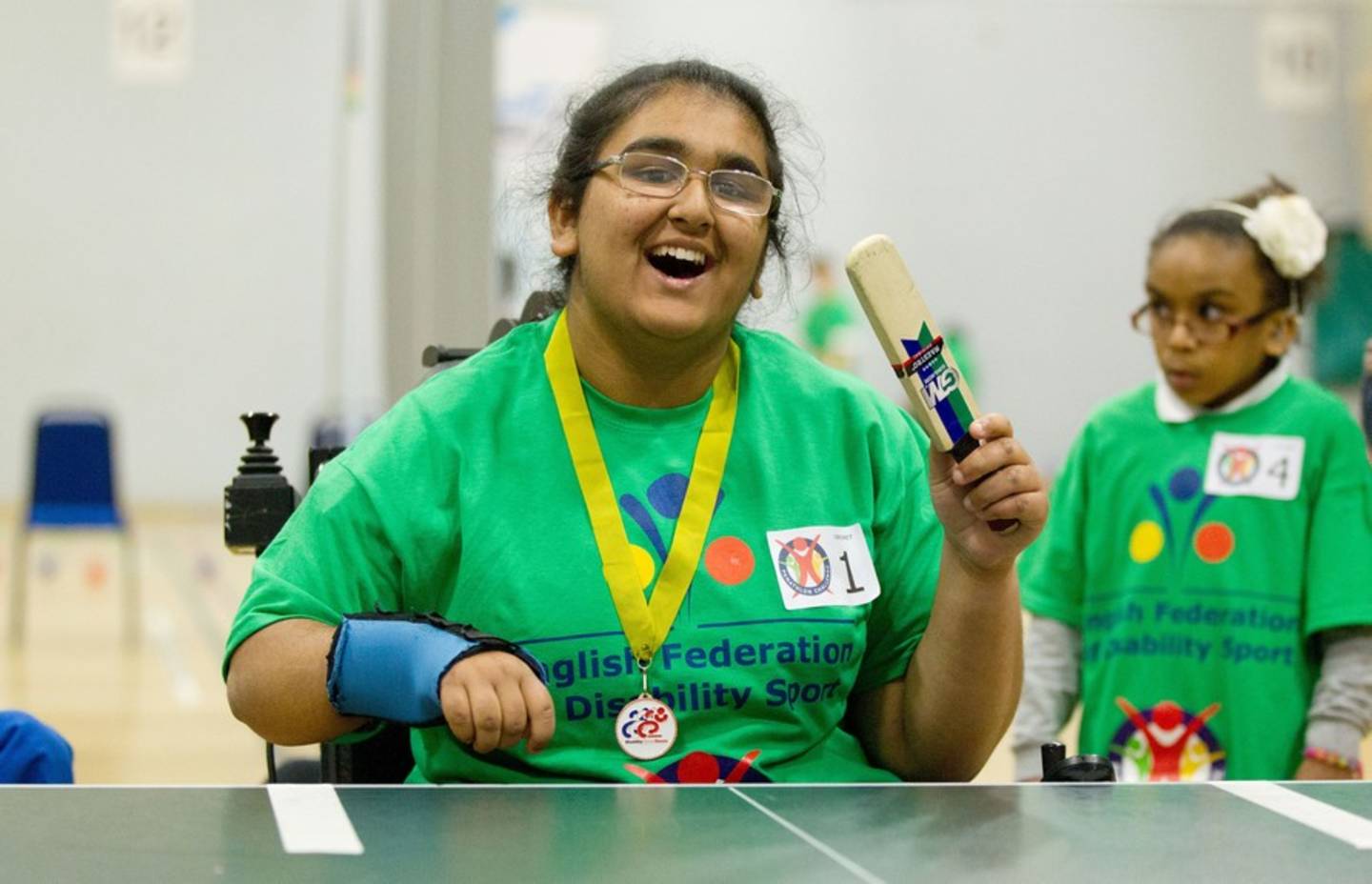 Girl playing table cricket