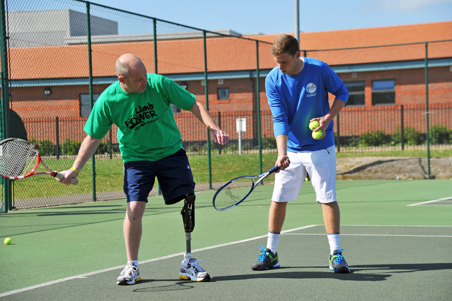 Man with coach playing tennis