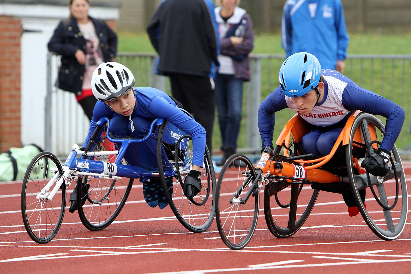 Two wheelchair racers on athletics track