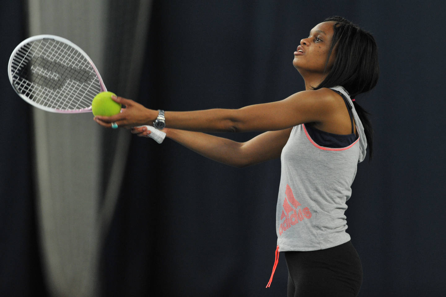 Player, who is visually impaired, playing tennis