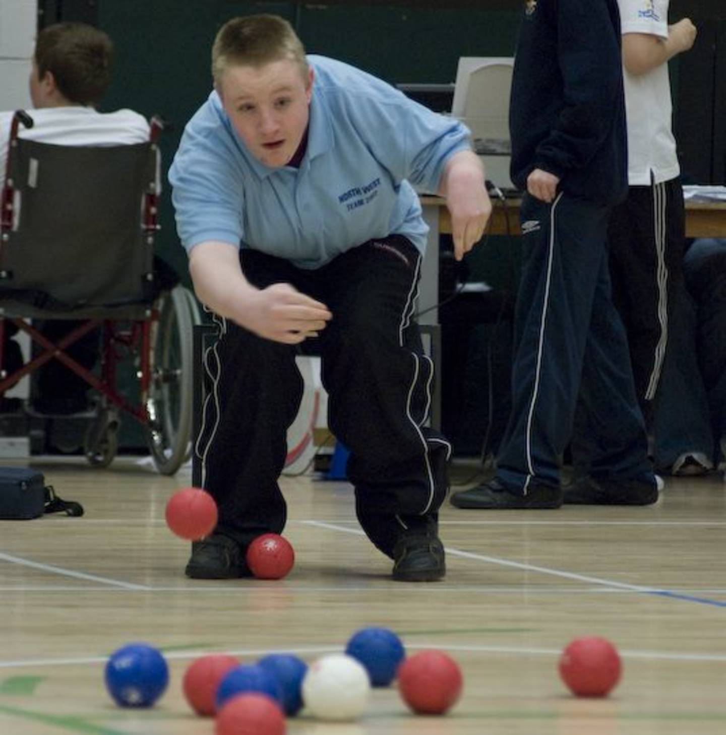 Boy playing boccia