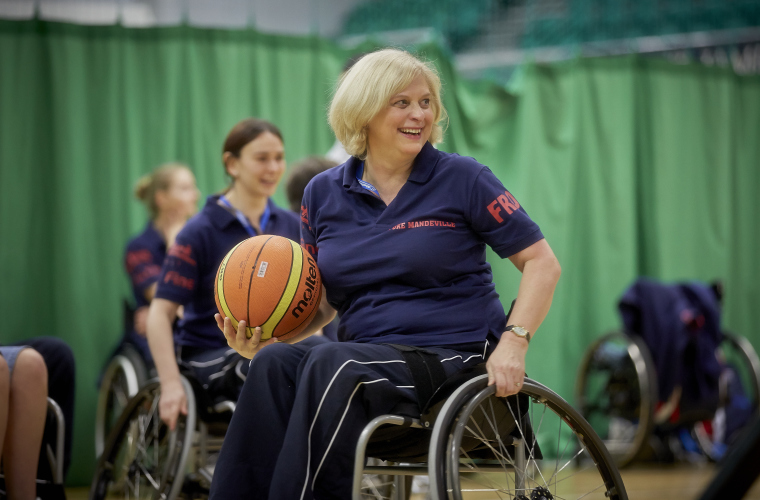 Woman playing wheelchair basketball