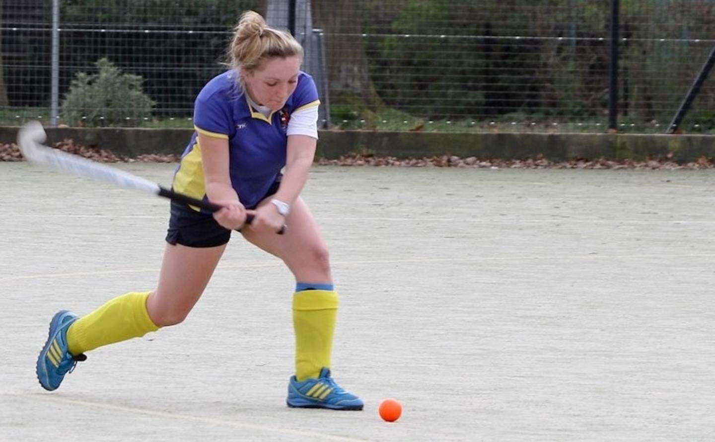 Volunteer Sophie Hook playing hockey