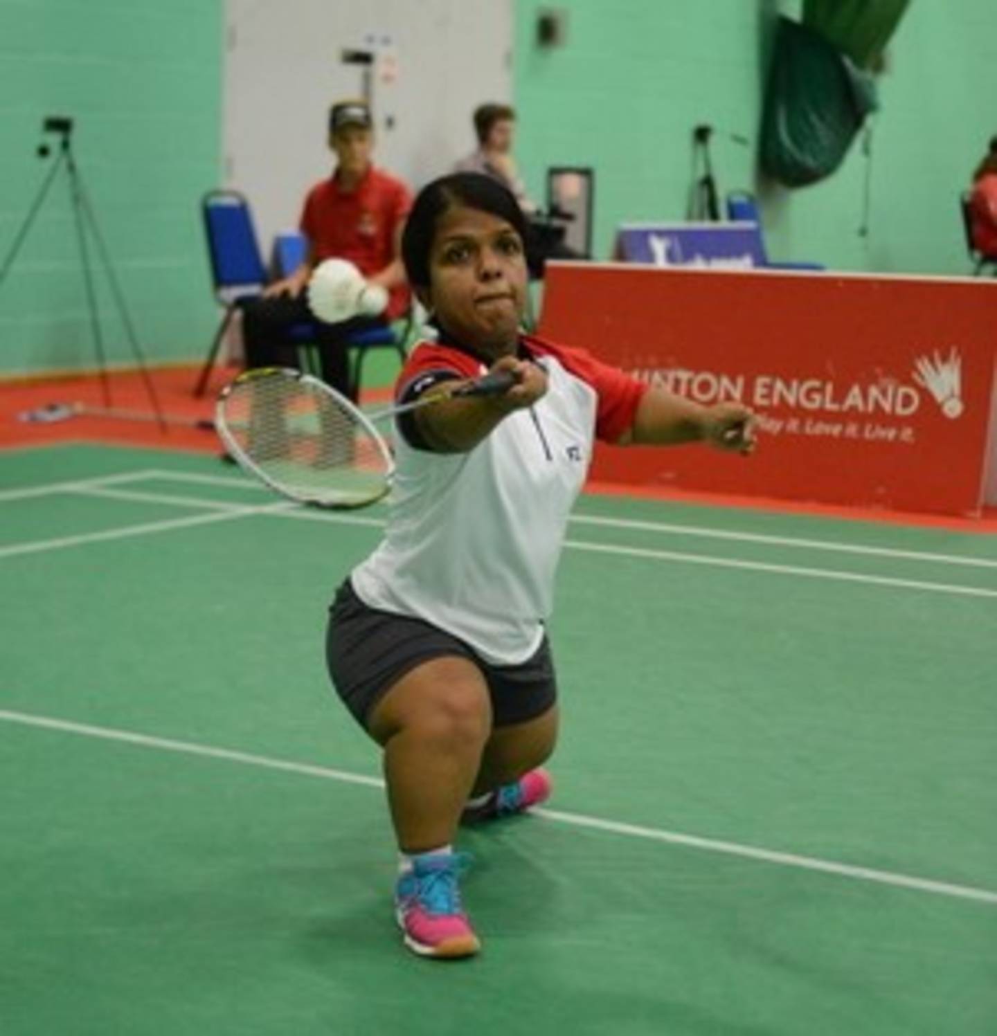 Image shows Randika playing badminton