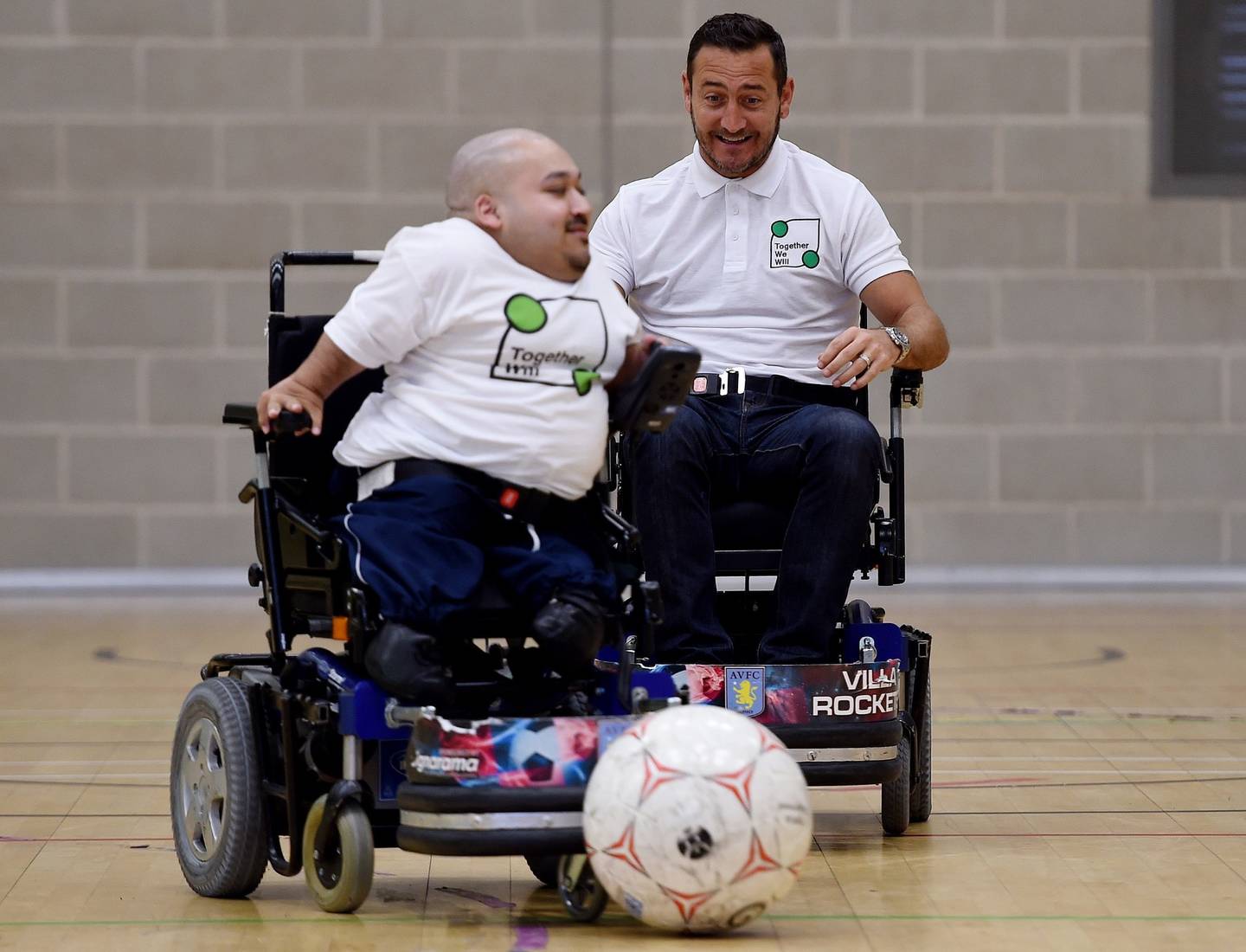 Image shows Amir Ali and Will Mellor playing powerchair football.