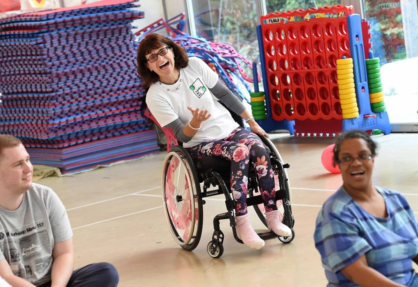 Amanda Worne playing sitting volleyball in inclusive sport session. 