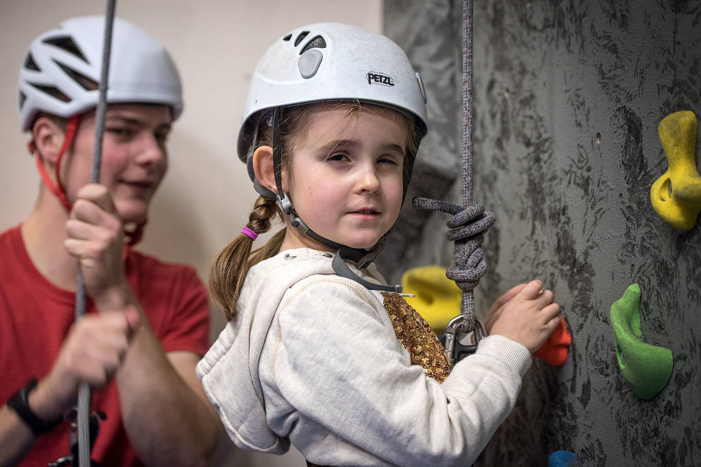 Young visually impaired girl, Ellie taking part in rock climbing. Photo credit: British Blind Sport