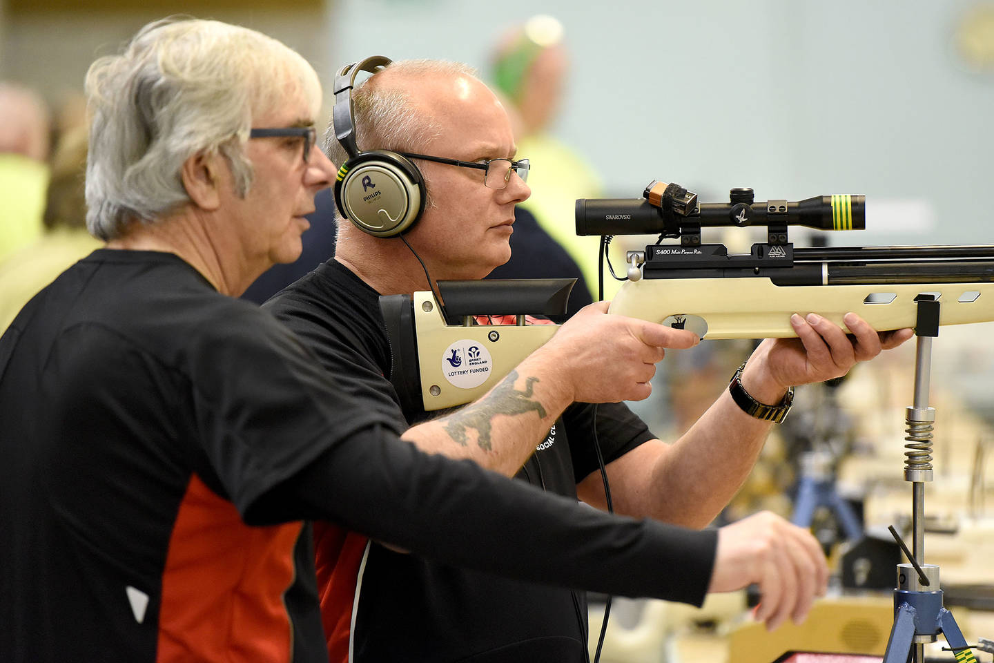 Visually impaired man taking part in acoustic shooting