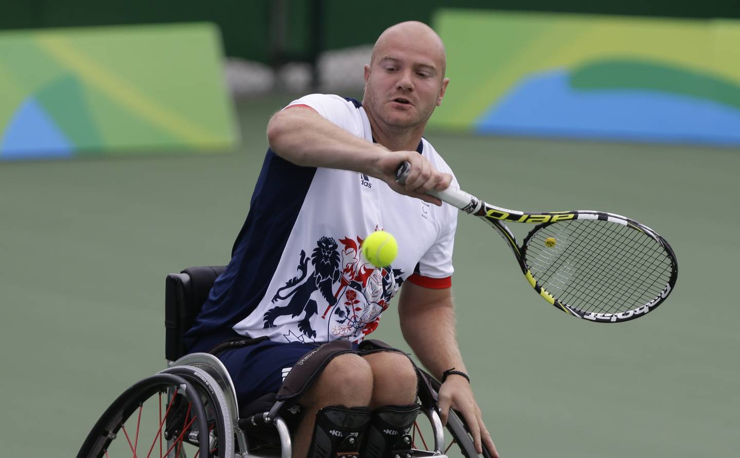 Tennis player Marc McCarroll playing back hand shot. 