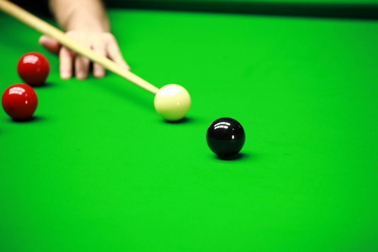 A player taking a shot in snooker