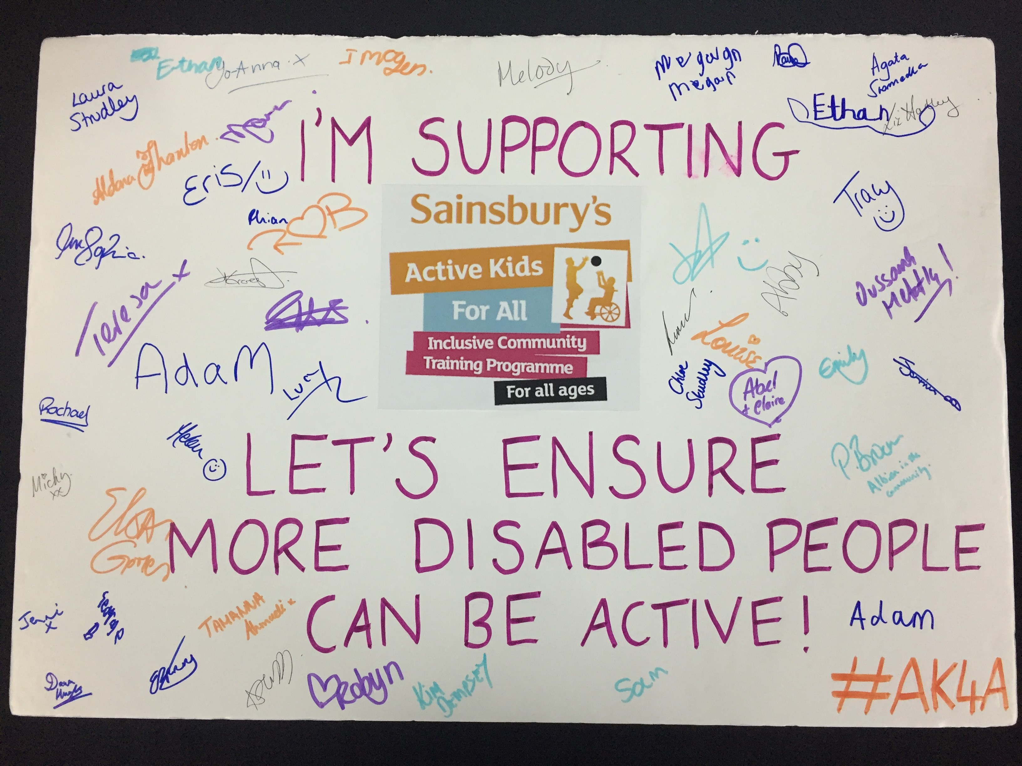 Signed pledge board reading 'Let's ensure more disabled people can be active!"