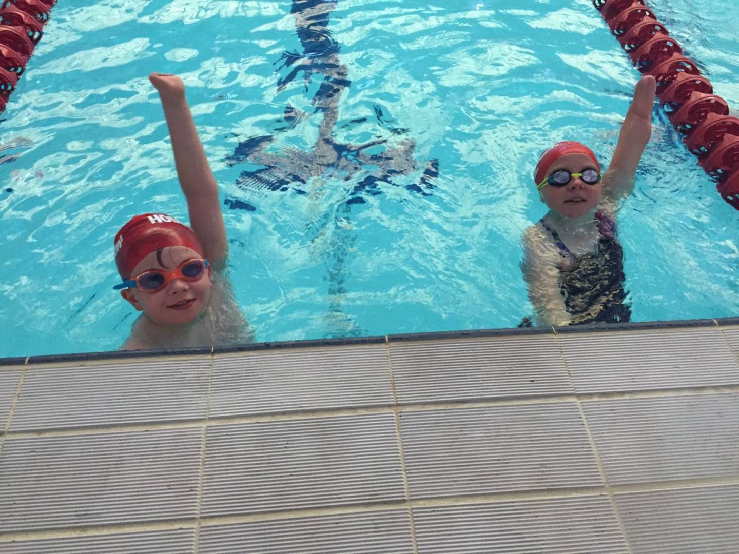 Louise and Sam celebrate success in the pool