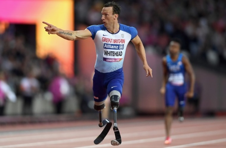 Richard Whitehead running on athletics track in World Para Championships 200m final
