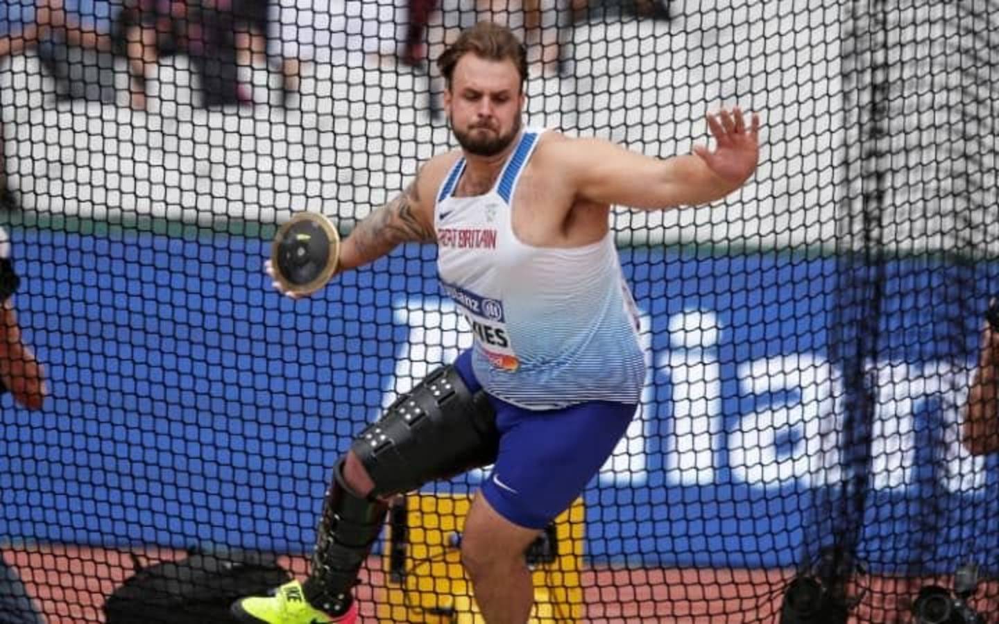 Athlete Aled Davies throwing discus at World Para Athletics Championships