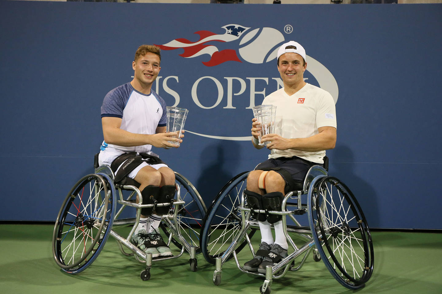 Alfie Hewett and Gordon Reid lift the trophy