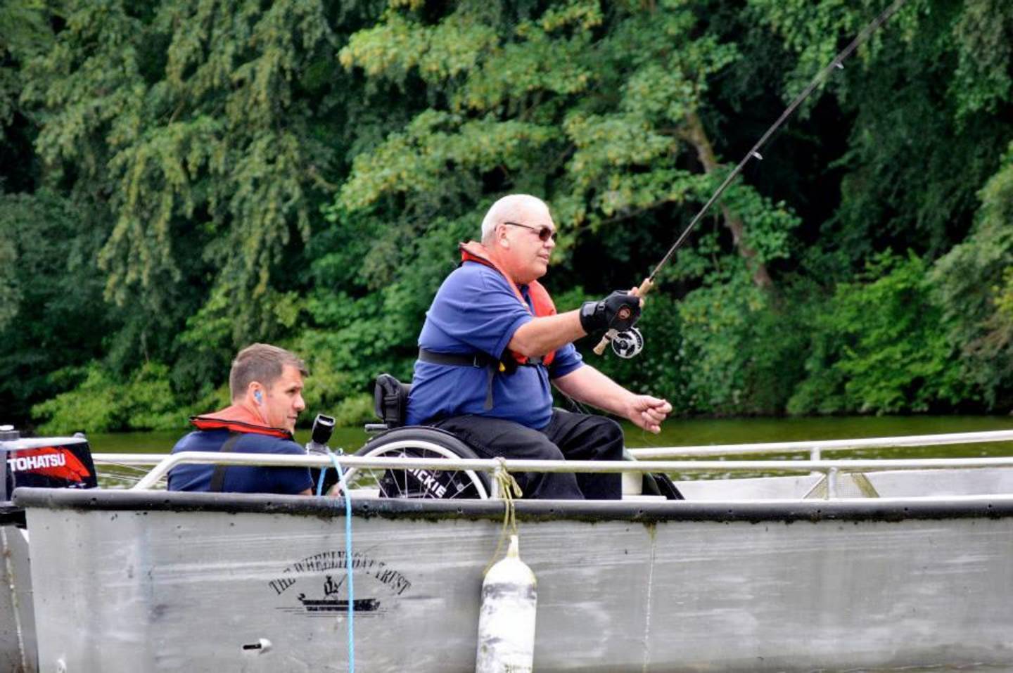 Terry Moseley fishing from a boat