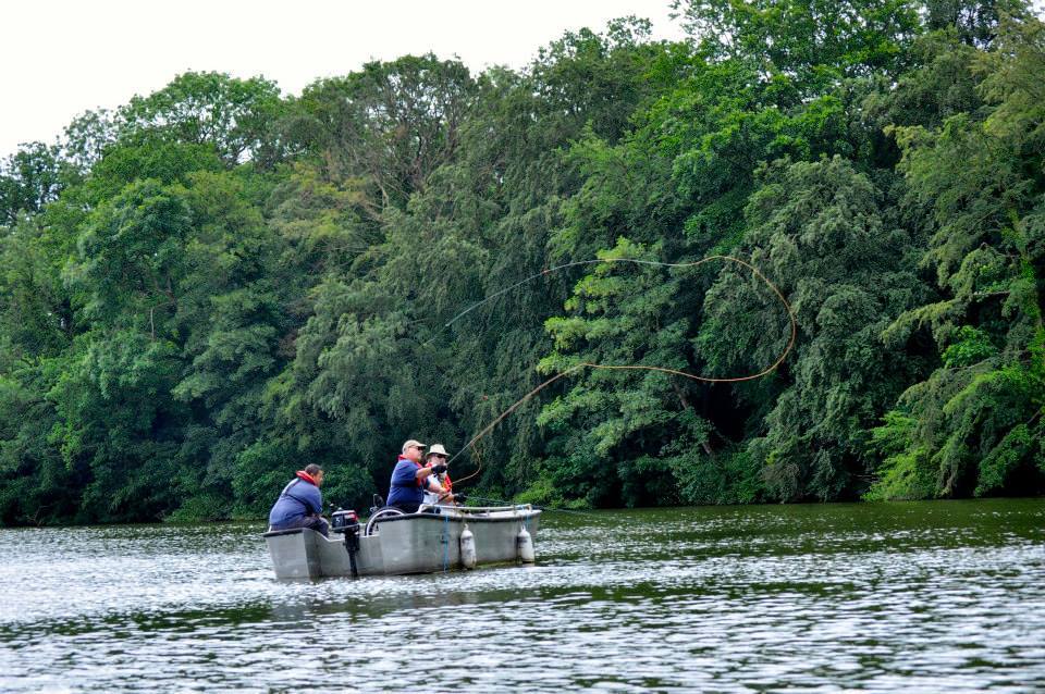 Terry Moseley casting a line from a boat