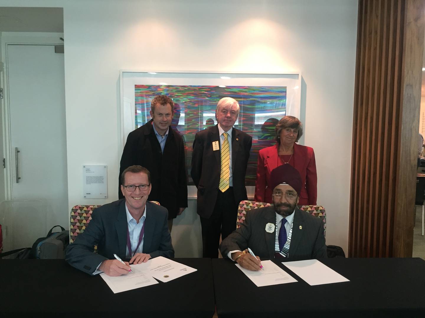 Barry Horne, CEO, and Lions signing the Partnership Charter