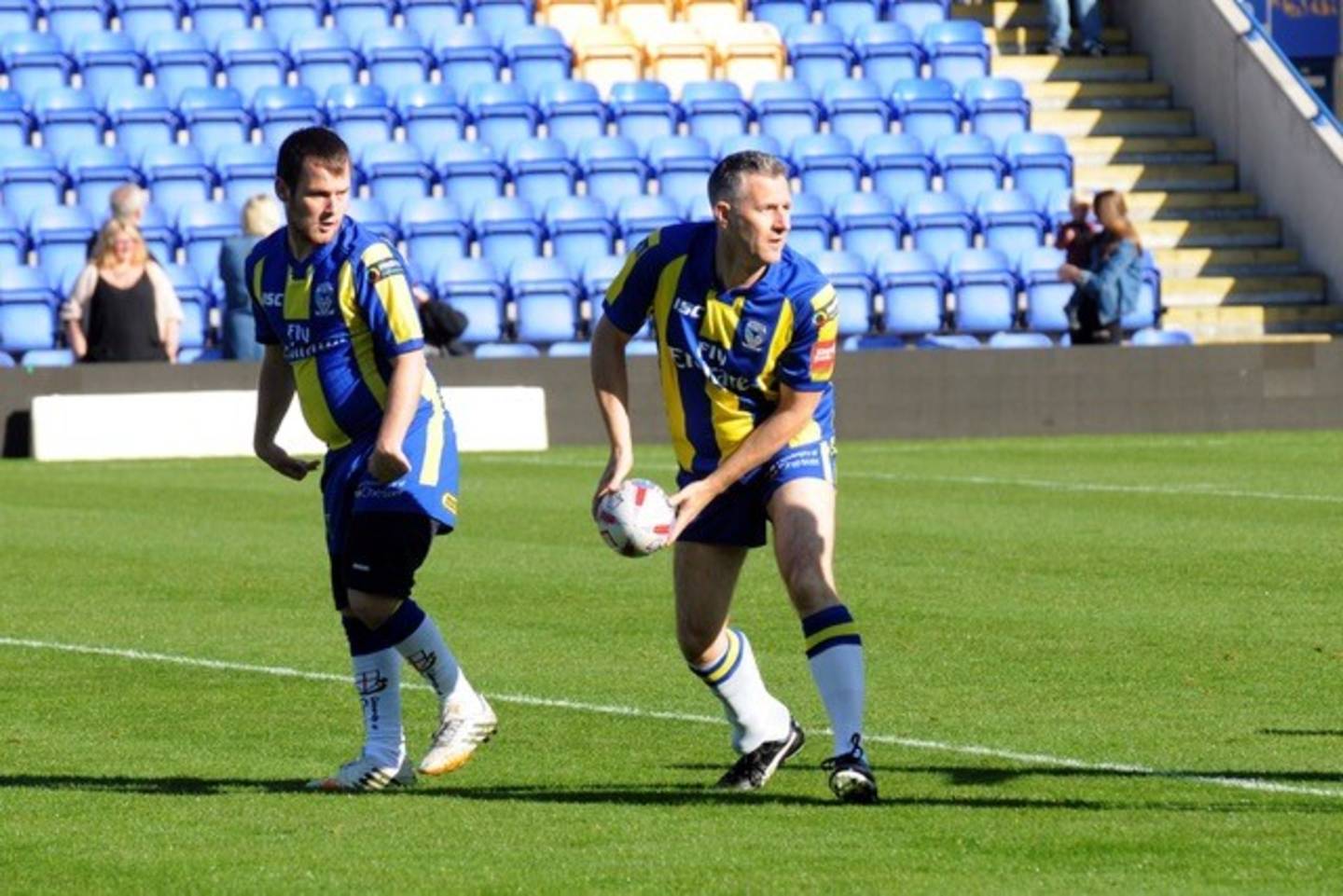 Adam Hills plays rugby league