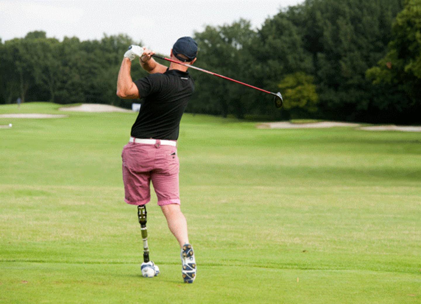 A man playing golf.