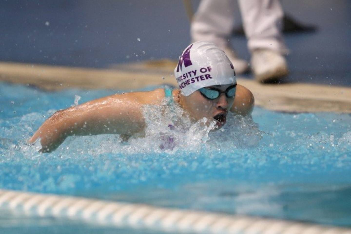 Para-swimmer Grace Harvey competing in a swimming race.