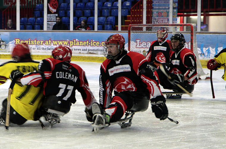 Phantoms para ice hockey players in match.  