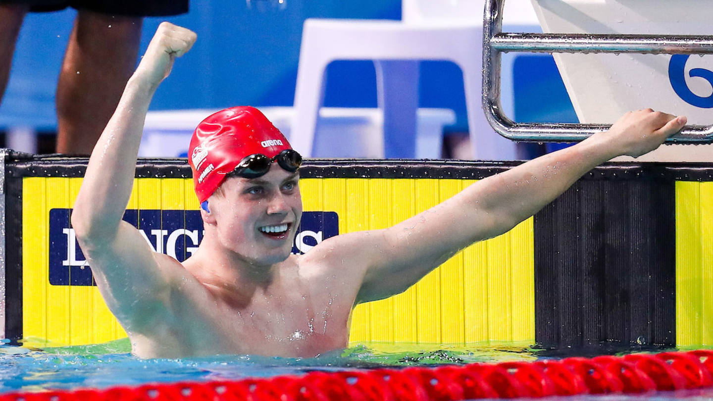 Tom Hamer celebrating Commonwealth gold medal swim in the pool
