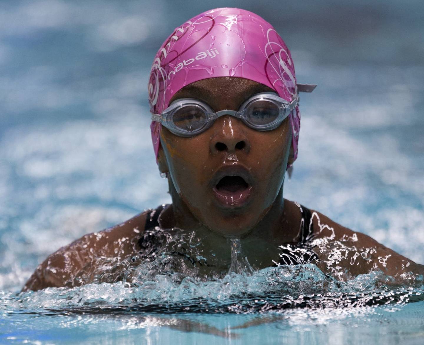 Junior swimmer swimming in race