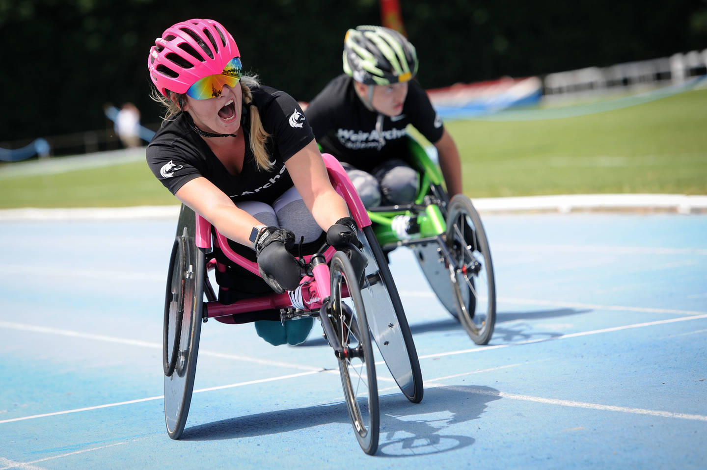 Two wheelchair athletes on the track