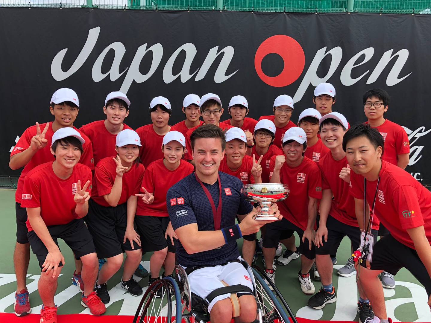 Gordon Reid celebrates victory with trophy at Japan Open Super Series 