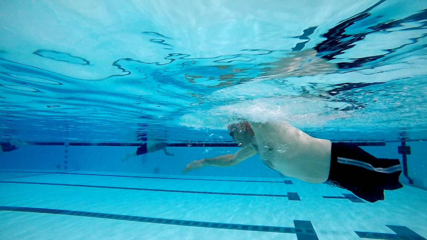 Anthony swimming underwater at Manchester Aquatics pool 