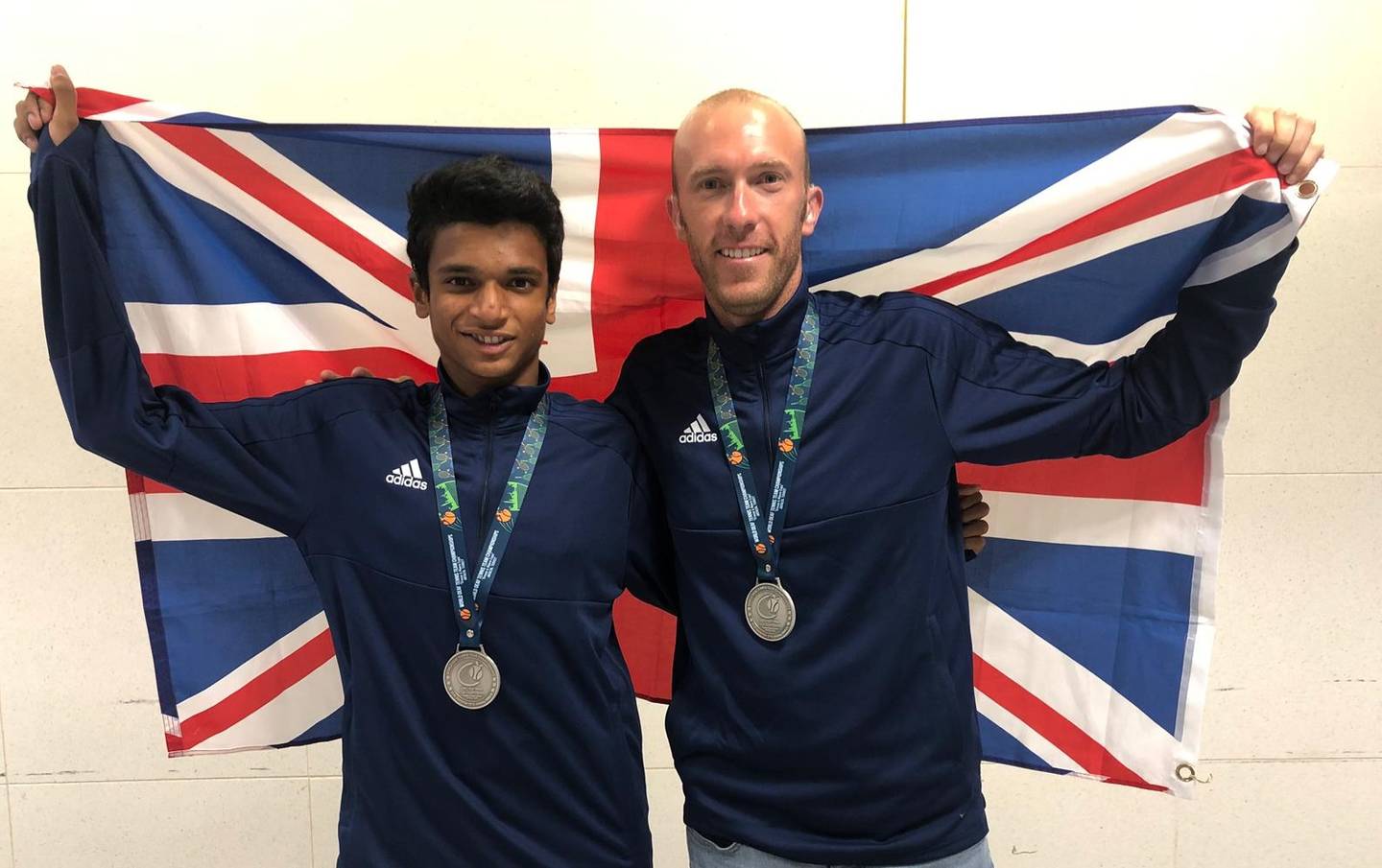 Esah Hayat and Lewis Flether with their silver medals