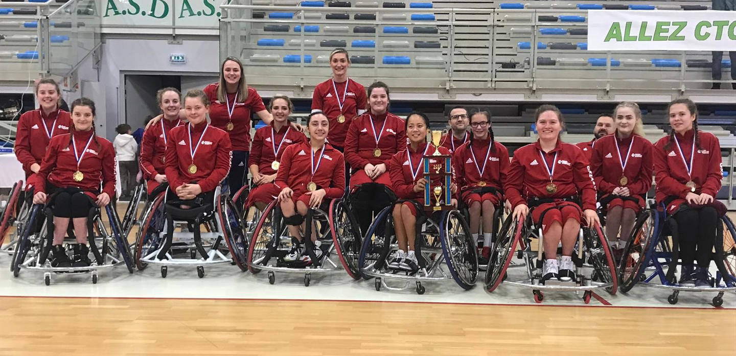 GB women wheelchair basketball team with European gold medals and trophy