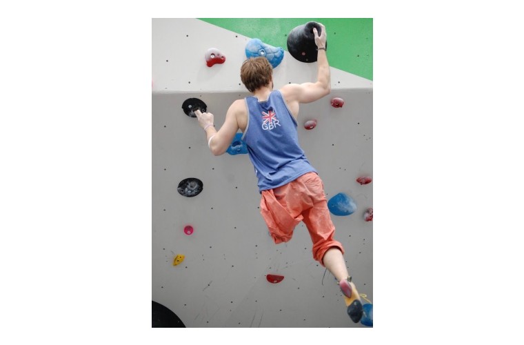 Martin, leg amputee climbing on indoor climbing wall 