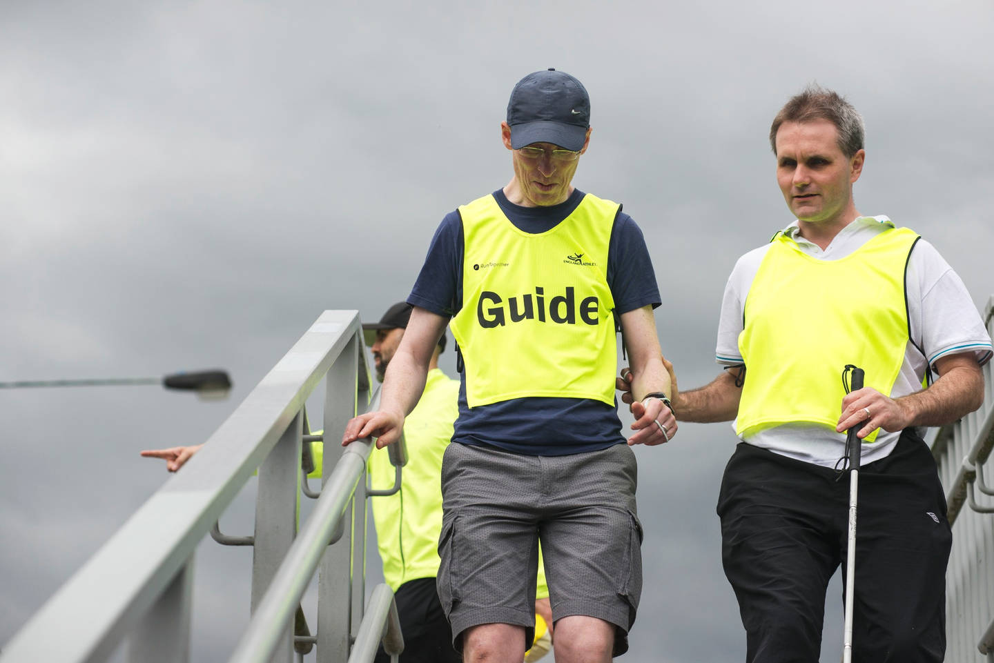 Visually impaired runner and guide runner