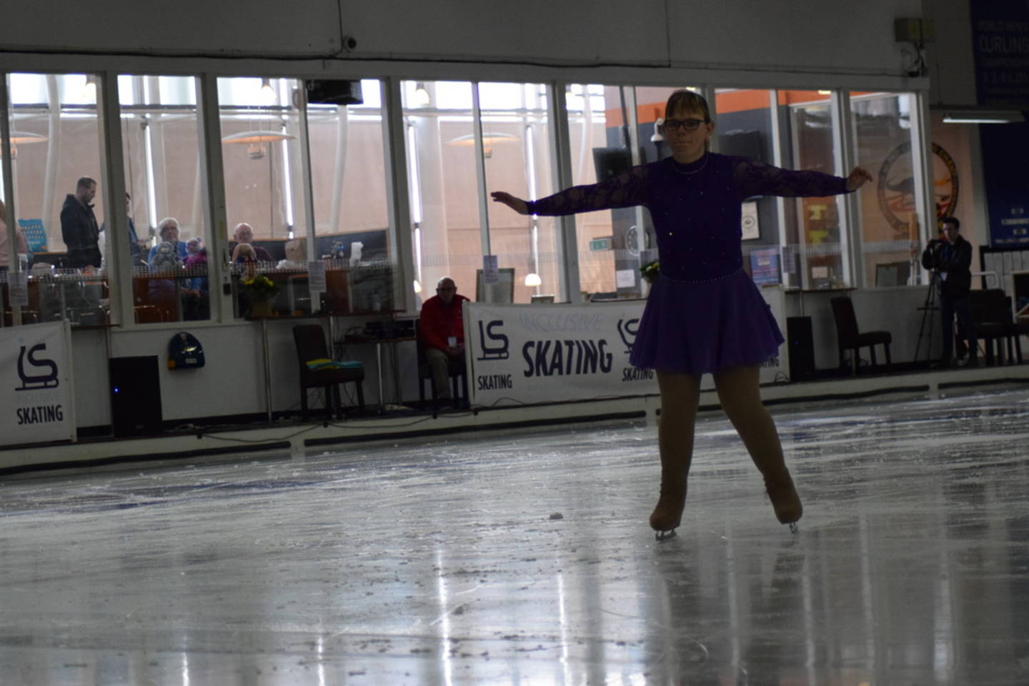 Vicki figure skating on the ice. 