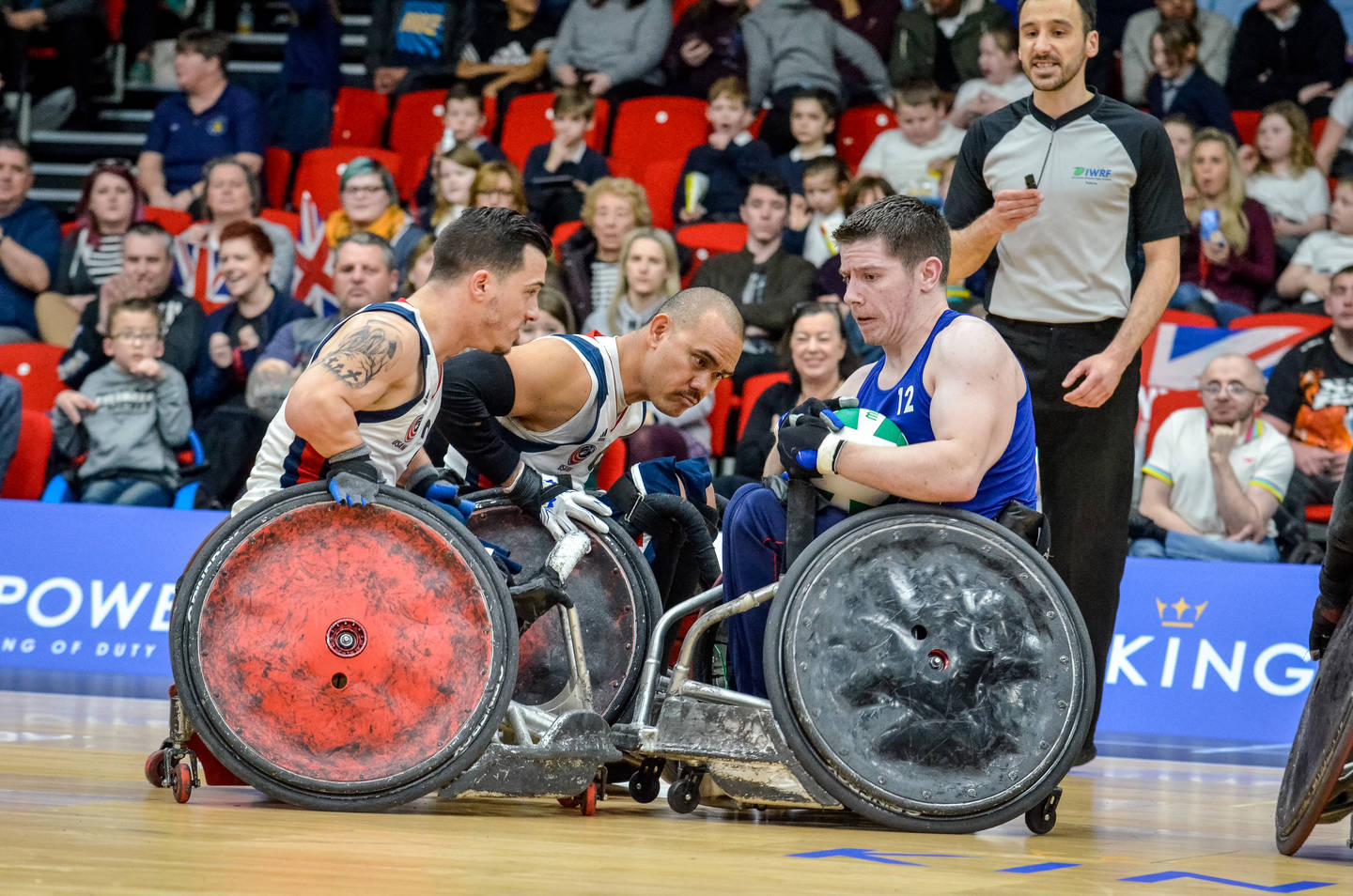 Wheelchair rugby players on court in match at Quad Nations tournament 