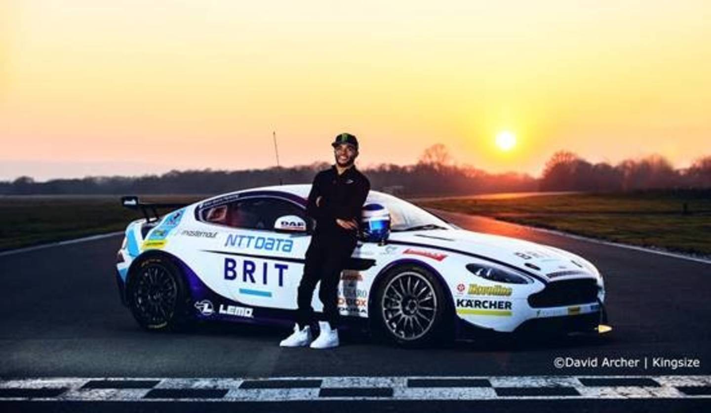 Nicolas Hamilton in front of a racing car