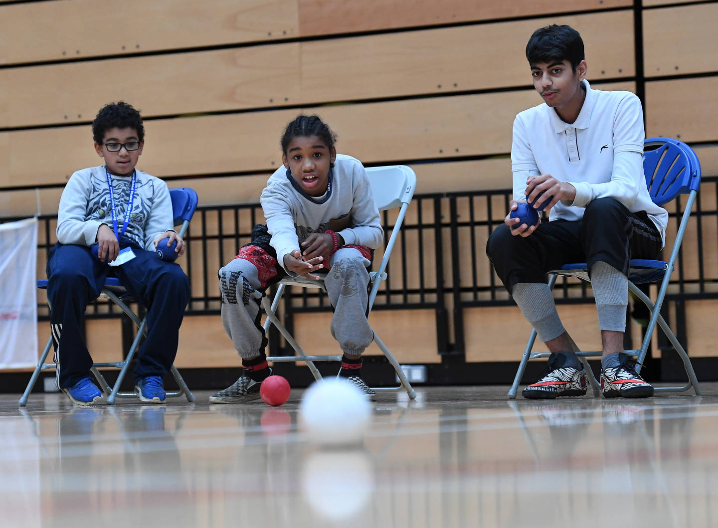 Three boys playing boccia at Special Olympics Great Britain festival