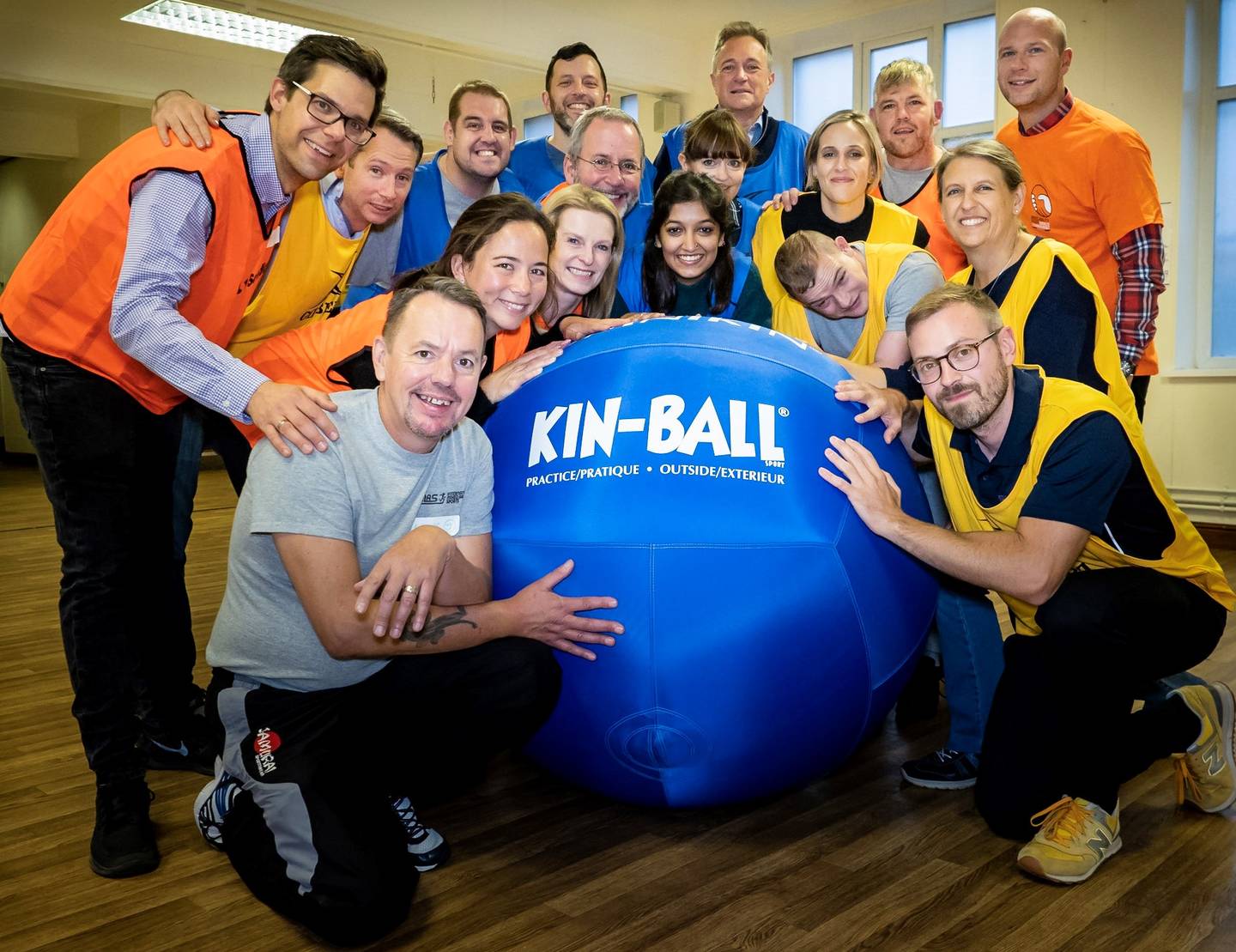 IMAS group holding a ball