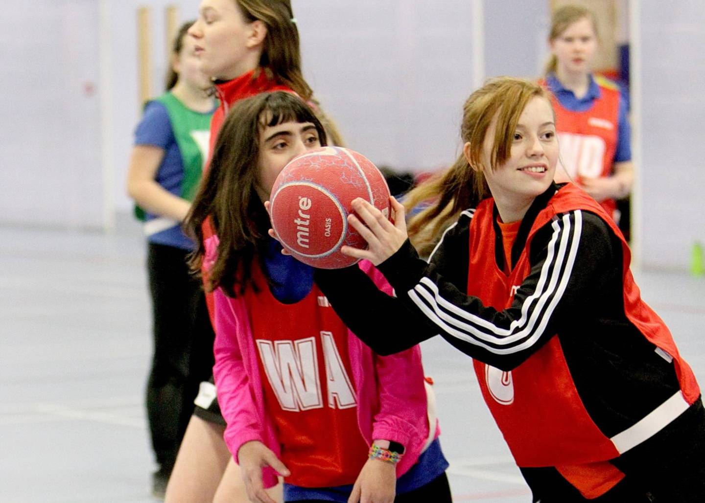 Girls playing netball