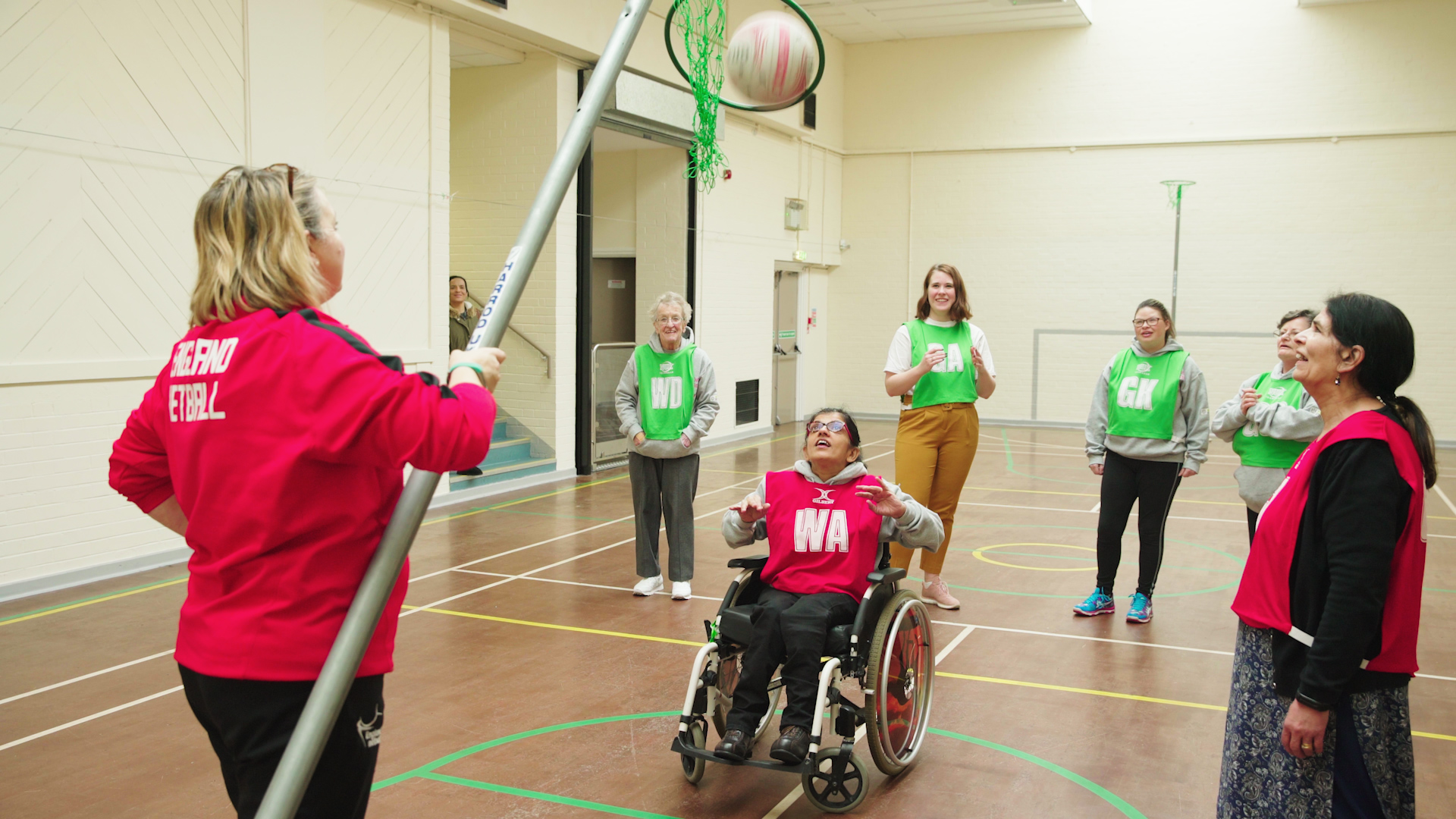 Wheelchair user shoots goal in inclusive netball session