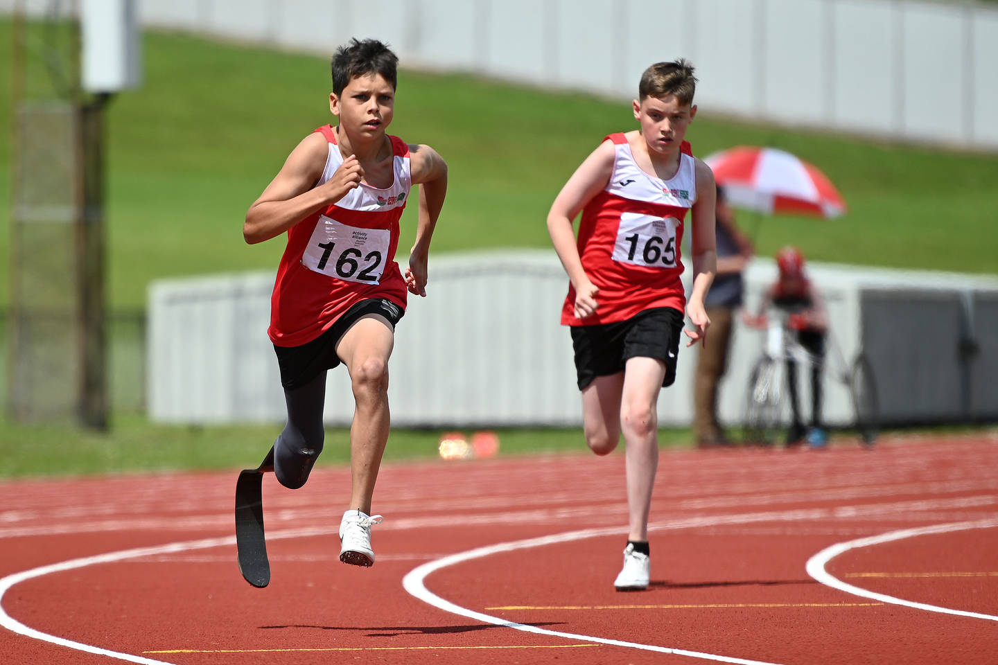 Two boys competing at Activity Alliance's National Junior Athletics Championships. 