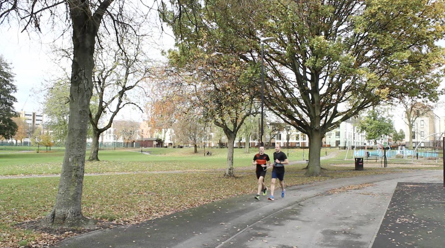 Dan, with guide-runner Nigel, running in Ordsall Park, Salford.
