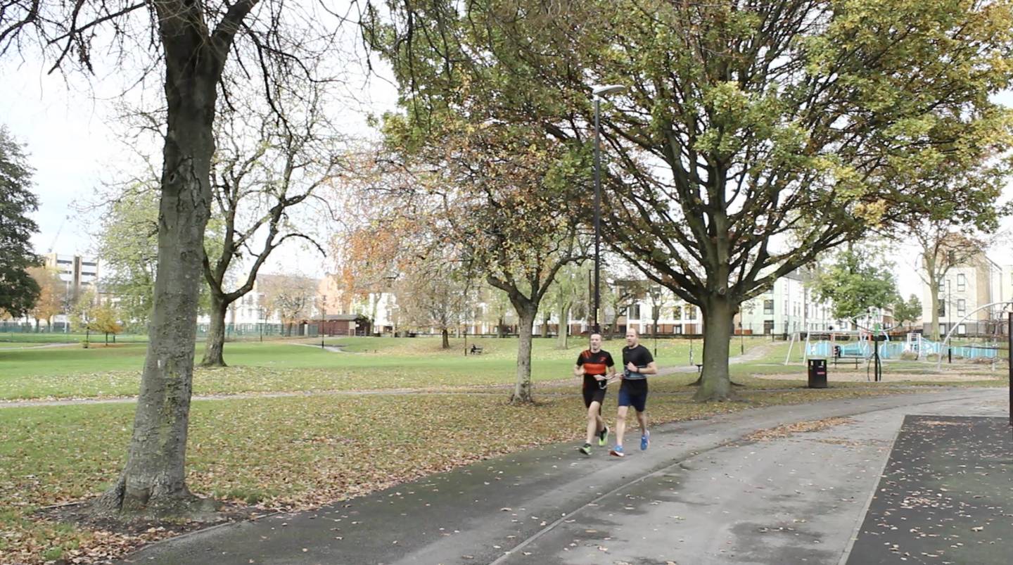 Dan, with guide-runner Nigel, running in Ordsall Park, Salford. 