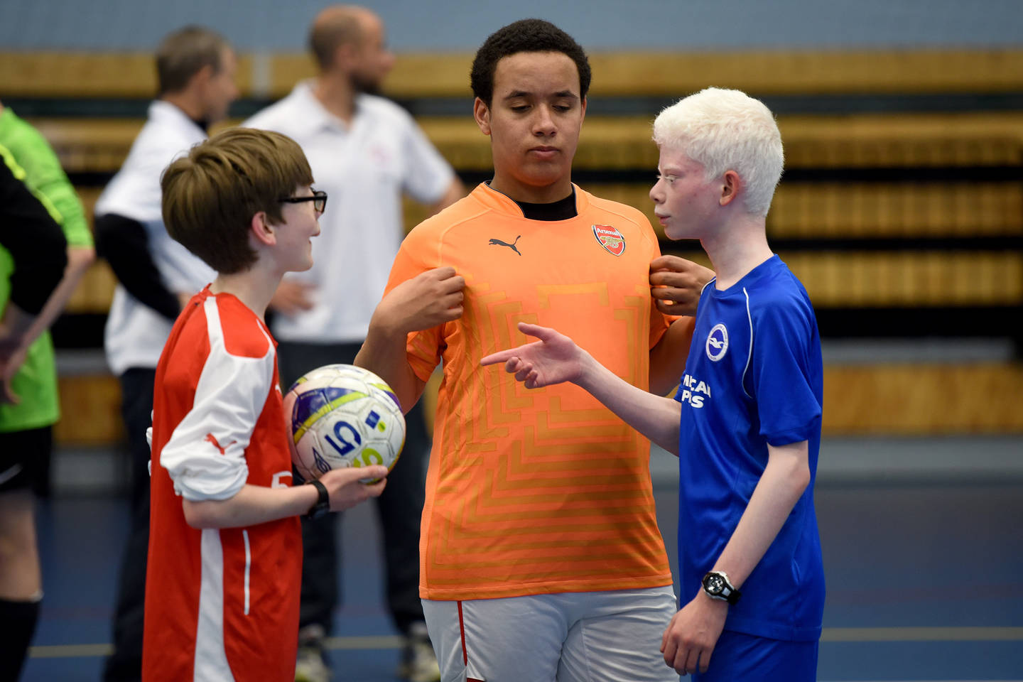 Visually impaired children playing indoor football