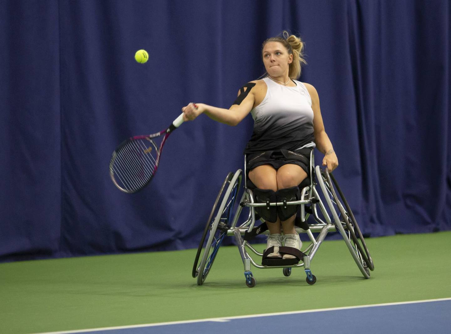 Jordanne Whiley hitting forehand shot in tennis match