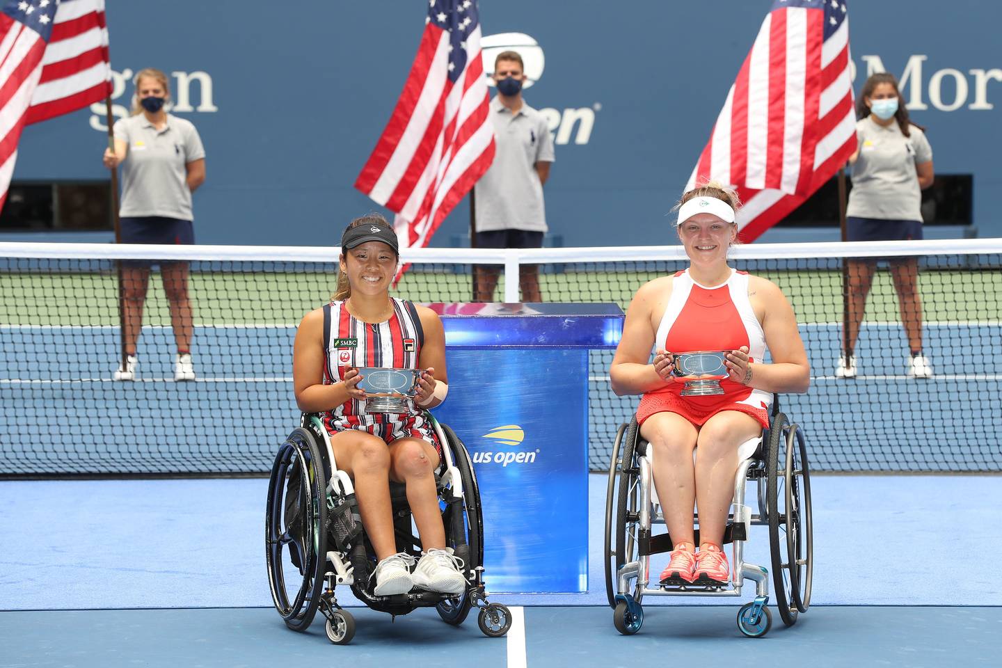 Jordanne Whiley and Yui Kamiji holding Women's Doubles Champions trophies.