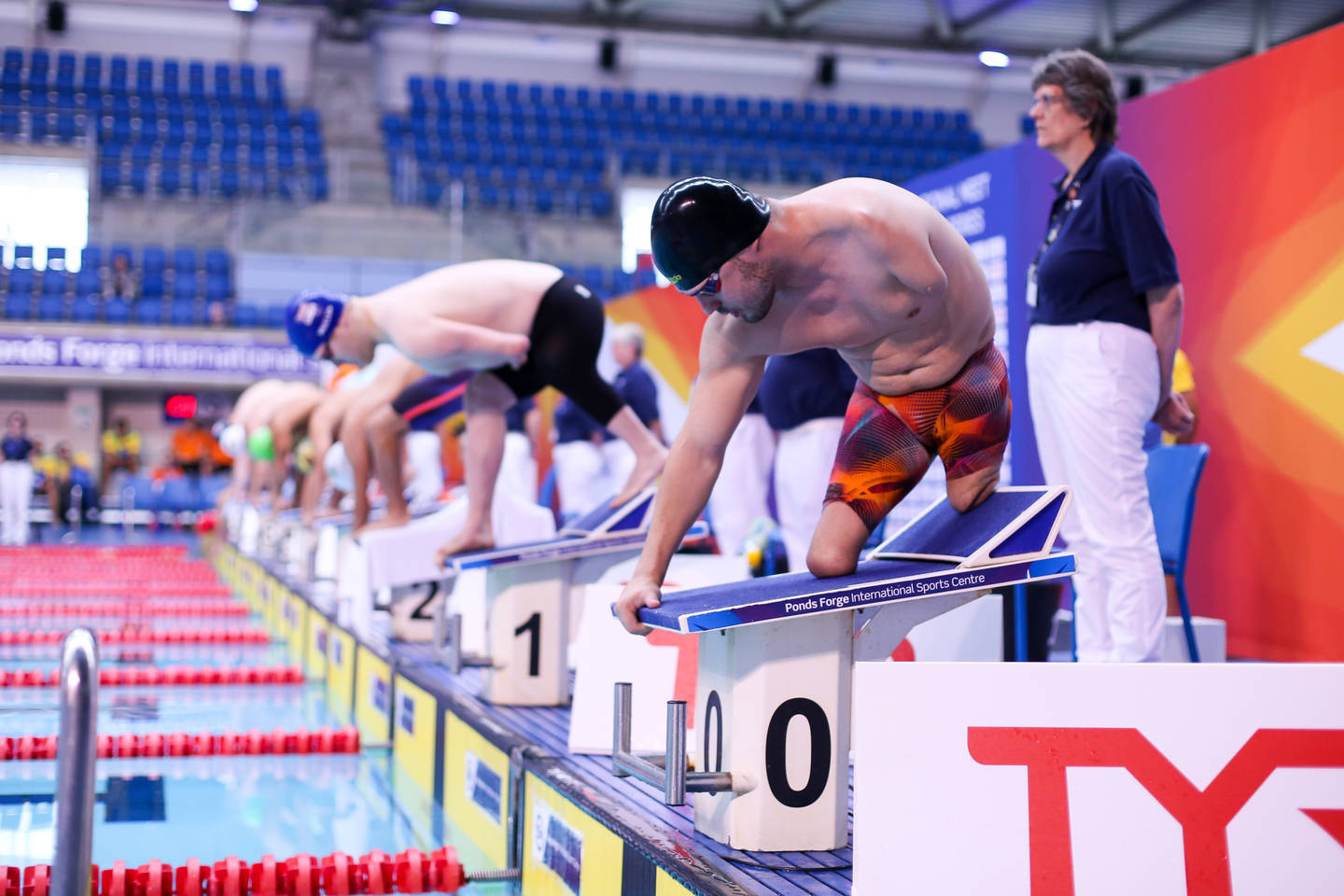 Athletes on starting blocks before swimming race at British Para-Swimming Championships